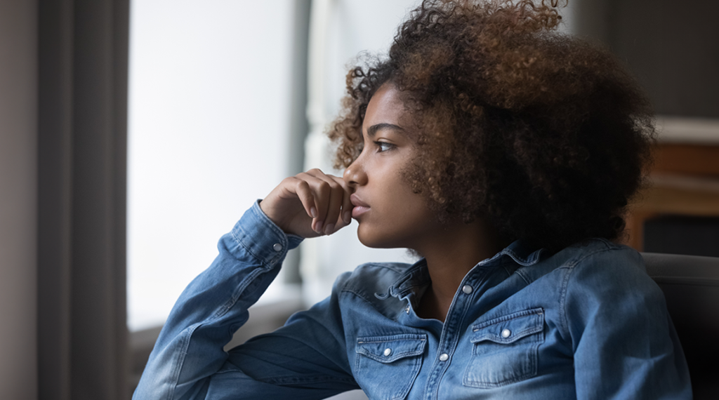 Thoughtful Black teen girl - sexual orientation OCD can cause confusion and uncertainty 