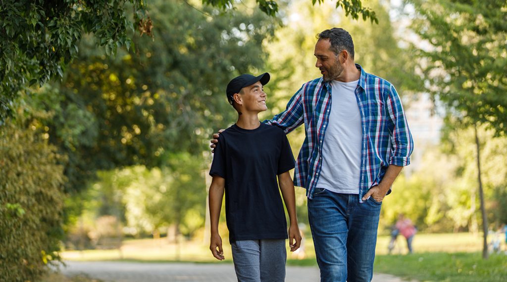 father and son walking
