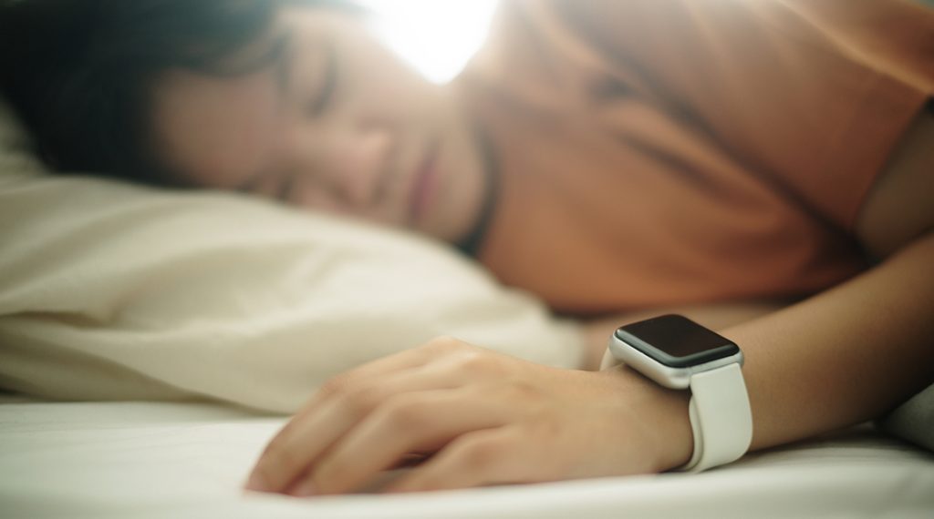 Teen sleeping with smartwatch - 