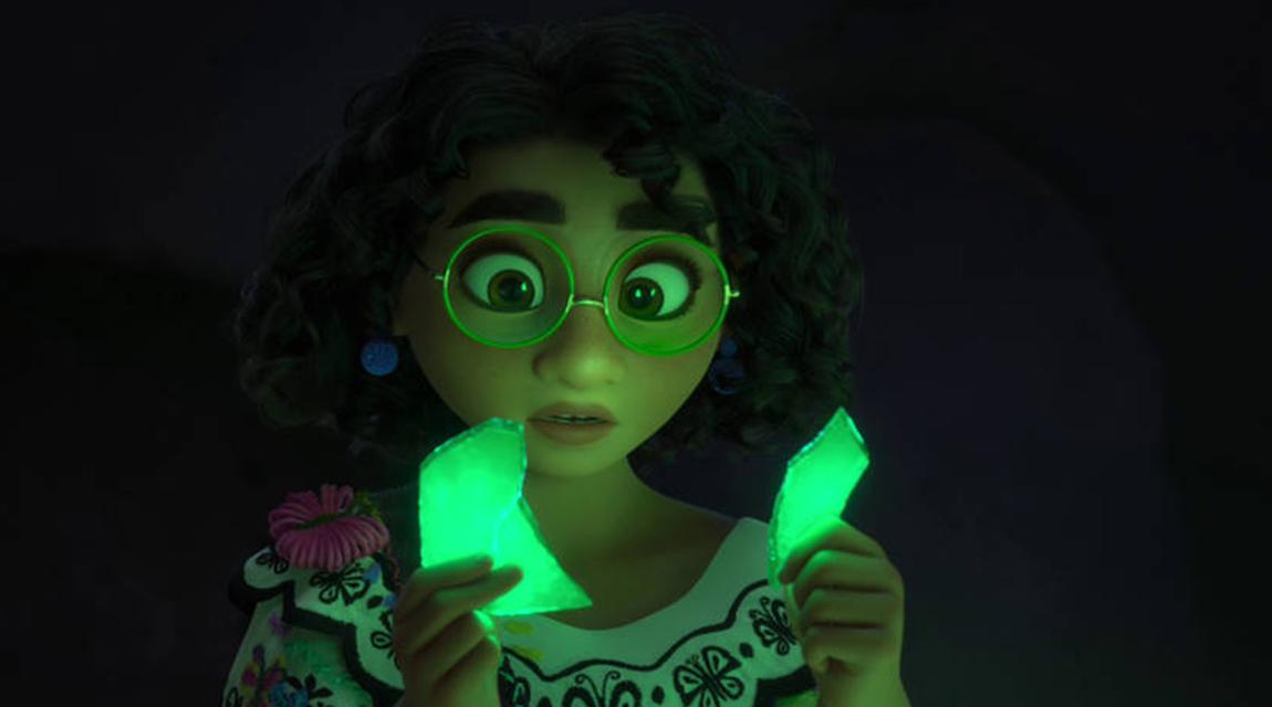 Mirabel from Encanto holding pieces of broken glass 